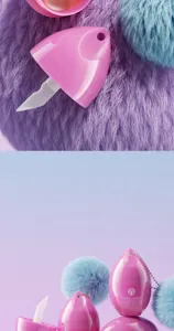 Detail view of pink egg-shaped lip balm with fluffy pompom keychain and applicator.