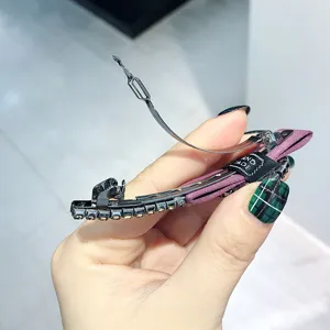 Detailed view of rhinestone bow hair clip spring clip fashion metal hair accessory crystal
