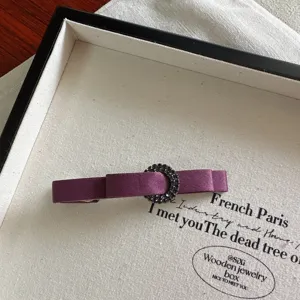 Minimalist purple satin bow hair clip with rhinestone circle buckle for elegant hairstyles.