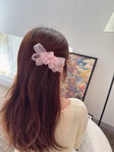 Pink mesh bow hair clip detail view, elegant butterfly hair barrette for women and girls.