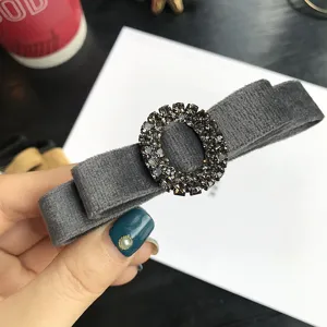 Grey velvet rhinestone bow hair clip elegant oval crystal spring clip detail view