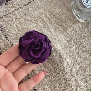 Korean style purple fabric camellia flower brooch pin for suit jacket and apparel accessories.