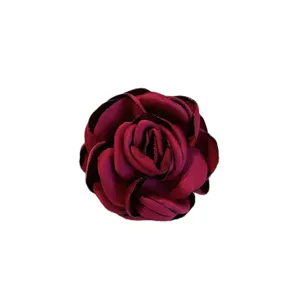Elegant fabric camellia flower brooch for women and men, stylish lapel pin and suit accessory.