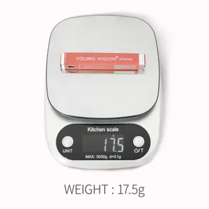 Close-up detail shot of YOUNG VISION lip gloss box placed on digital scale showing product weight.