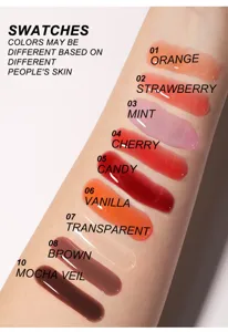 Clear glass lip gloss oil swatches showcasing multiple fruit shades for shiny lips.