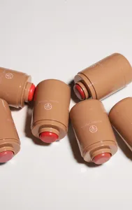 Detailed shot of cream blush sticks in multiple shades, smooth texture for easy lip and cheek makeup.