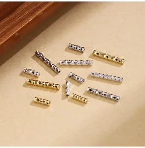 Silver and gold faceted tube spacer beads for DIY jewelry making and bracelet design.
