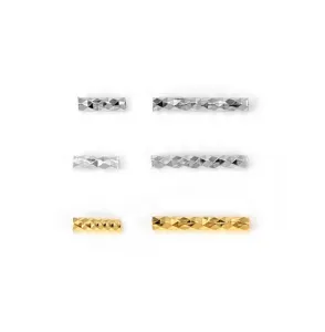 Detailed view of sparkling faceted straight tube spacer beads for DIY jewelry making.