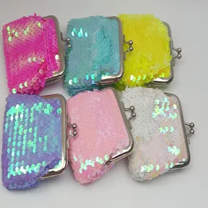 Detailed view of colorful 3-inch iridescent sequin coin purses with metal kiss-lock closure.