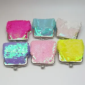 3-inch iridescent sequin coin purse detail showing vibrant colors and metal clasp closure.