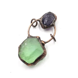 Rough crystal gemstone pendant detail, vintage copper wrapped handmade jewelry accessory.
