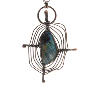 Handmade copper wire wrapped labradorite gemstone pendant vintage gothic style jewelry detail shot