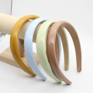Detailed view of pastel PU leather headbands set, glossy wide hair hoops for women daily wear.