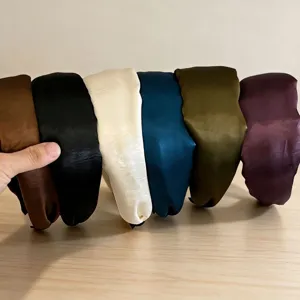 Details of wide satin headbands in multiple colors, elegant high-crown hair accessories.