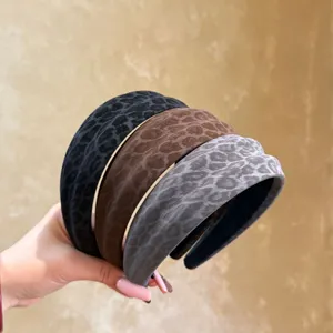 Retro leopard print wide headband detailed view, stylish autumn winter hair accessory design.