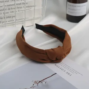 Brown suede knotted headband for women, stylish vintage hair hoop for daily wear and fashion.