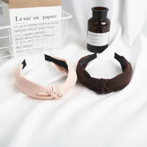 Minimalist suede knotted hairband set in pink and brown colors, stylish everyday hair accessories.