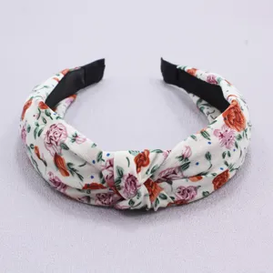 Floral print knotted headband detail, soft fabric daily hair accessory for women.