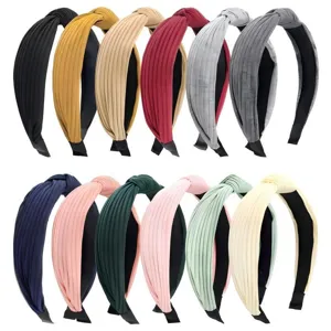 Pleated knotted headband detail shot showcasing the texture and multiple vibrant color options.