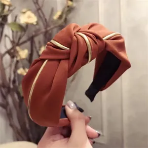 Korean style wide fabric headband with elegant gold trim and stylish cross knot design for women