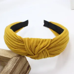 Mustard yellow knitted wide hair hoop with stylish cross knot design, perfect for daily wear.