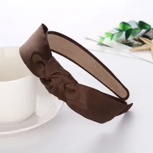 Brown satin knotted headband detail shot, elegant twisted hair hoop for daily fashion styling.