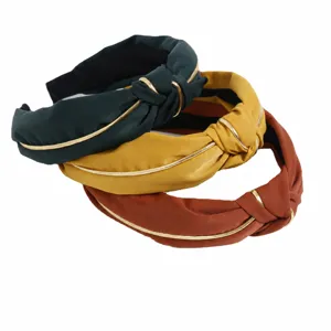 Korean style wide fabric headband with gold piping and cross knot design for women daily wear.