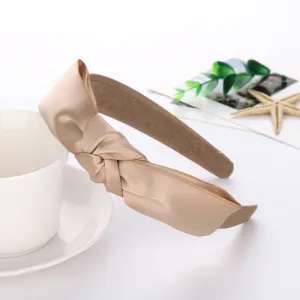 Champagne satin knotted headband for women, elegant daily hair accessory, comfortable fit.
