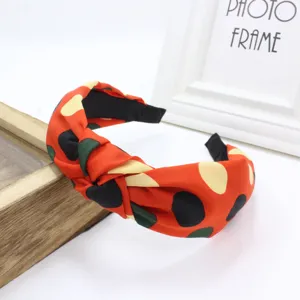 Korean style wide cloth fabric cross knotted headband detail view for women hair accessories.