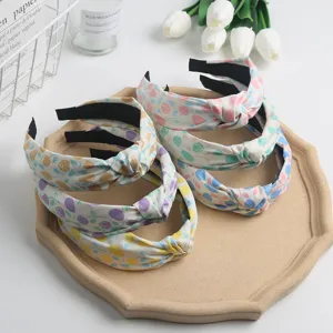 Chic floral knotted headband with sweet pastel print, elegant fabric hair hoop for daily wear.