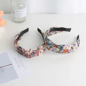 Detailed close-up of sweet floral knotted headbands with fabric wrap, perfect for cute daily hair.