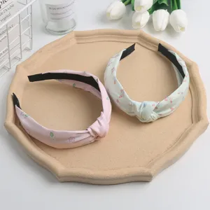 Sweet floral knotted headband set, cute pink and green fabric hair hoop for daily wear.