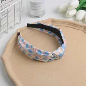 Sweet floral knotted headband for women and girls, stylish fabric hair hoop daily wear.