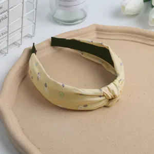 Yellow floral knot headband for women, sweet cute hair accessory for daily wear wash face.