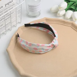 Sweet floral knotted fabric hair hoop, stylish daily hair accessory for women and girls.