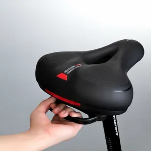 Comfortable bicycle saddle with rear safety handle, shock-absorbing design for mountain bikes.
