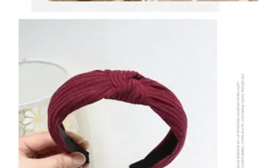Wine red knitted wide cross headband detail showing soft ribbed fabric texture and style.