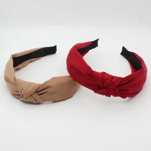 Solid color cross knotted wide brim headband, fashionable simple hair accessory for daily wear.