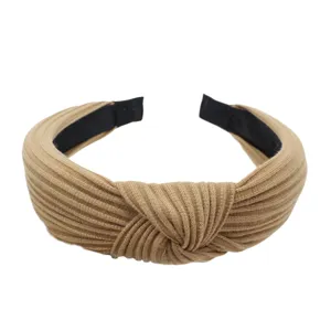 Knitted cross knotted wide headband, fashionable Maillard style hair accessory for daily wear.