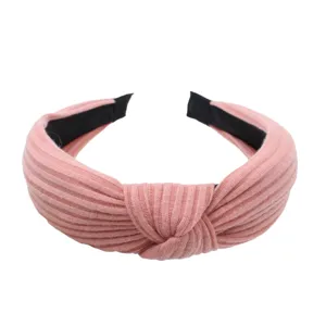 Pink knitted wide headband with twist knot design, soft fabric hair hoop for daily wear.