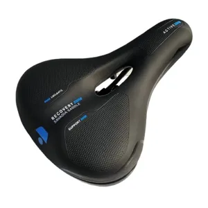 Close-up view of the black bicycle saddle showing ergonomic cutout and breathable textured surface.