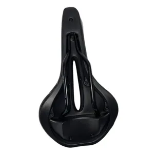Detailed bottom view of a black bicycle saddle with metal rails and hollow ergonomic design.