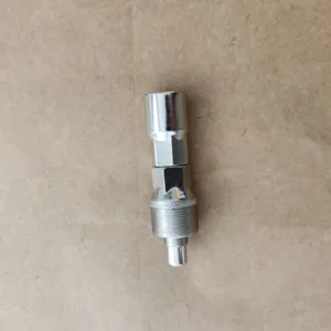 Close-up detail of silver metal bicycle crank puller tool, durable steel construction.