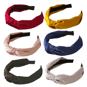 Classic knotted fabric headband detail view, soft satin texture, elegant solid color hair accessory.