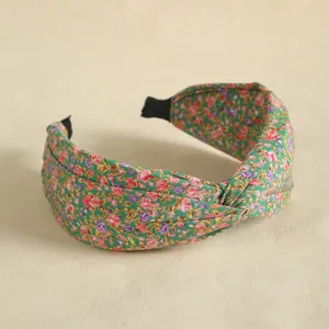Floral knotted headband for women, wide brim cloth hair hoop with vintage botanical print style.