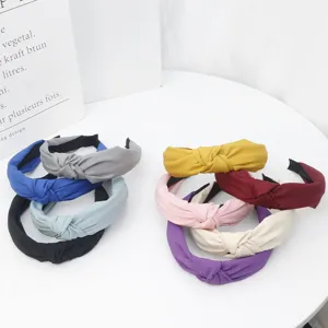 Colorful wide cloth headbands for women, stylish knotted hair hoops for daily wear.