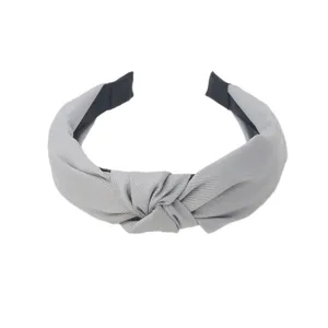 Grey knotted fabric headband detail, wide solid hair hoop, minimalist daily hair accessory.
