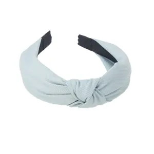 Light blue knotted headband with ribbed texture, wide brim minimalist hair accessory for daily use.