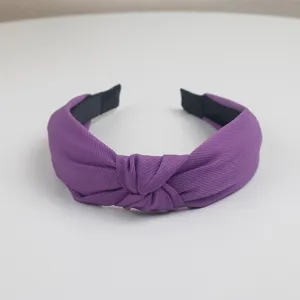 Purple twill knotted headband for women, simple wide brim breathable hair hoop detail.
