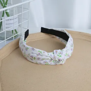 Chic floral headband with elegant knot design, retro style fabric hair hoop for women.